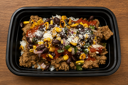 Blended Beef Enchilada Bowl with seasoned beef, rice, enchilada sauce, corn, poblano, black beans, purple onion, and cotija